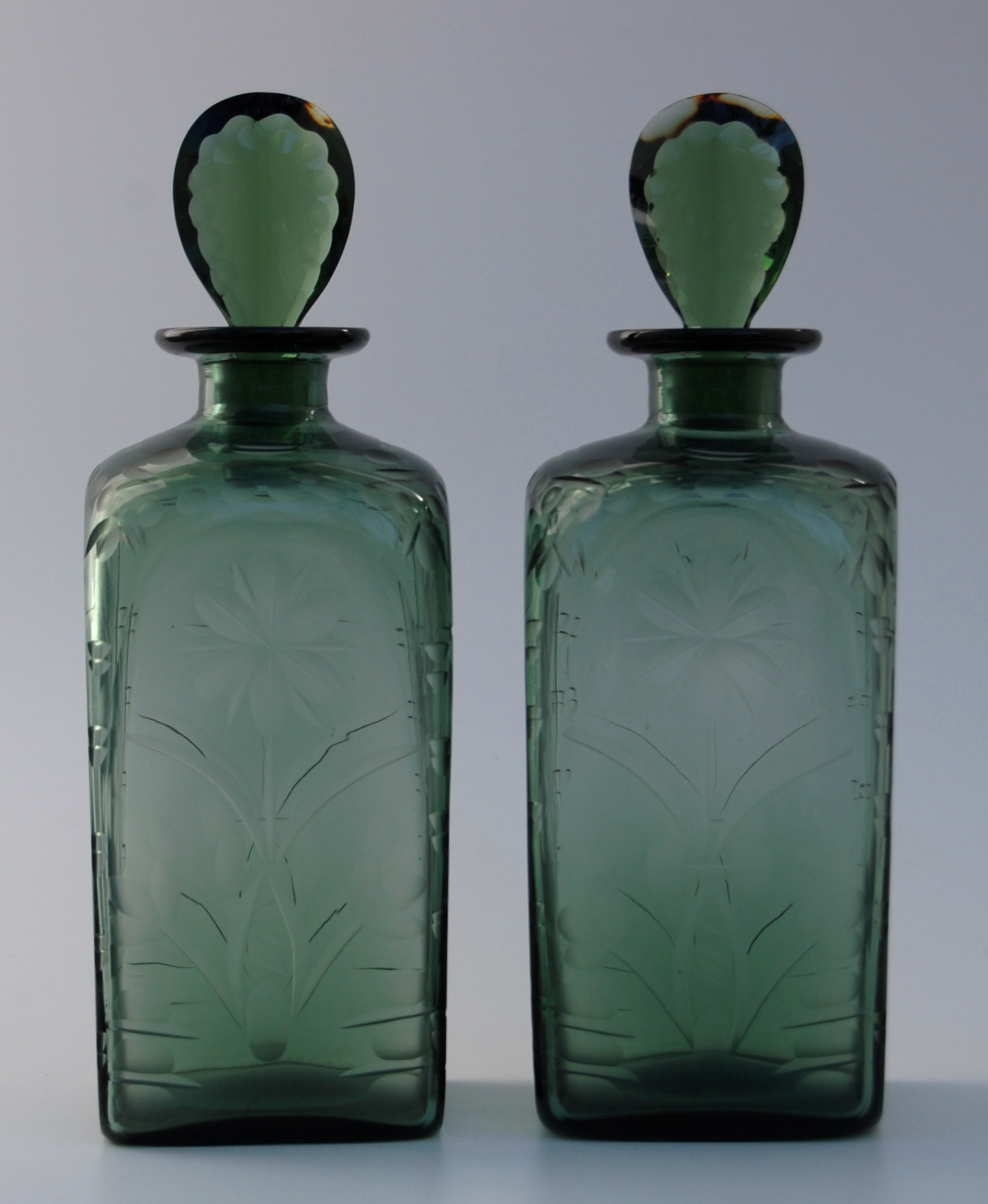 ApairofdarkgreenSpanishcutdecantersc1900.JPG